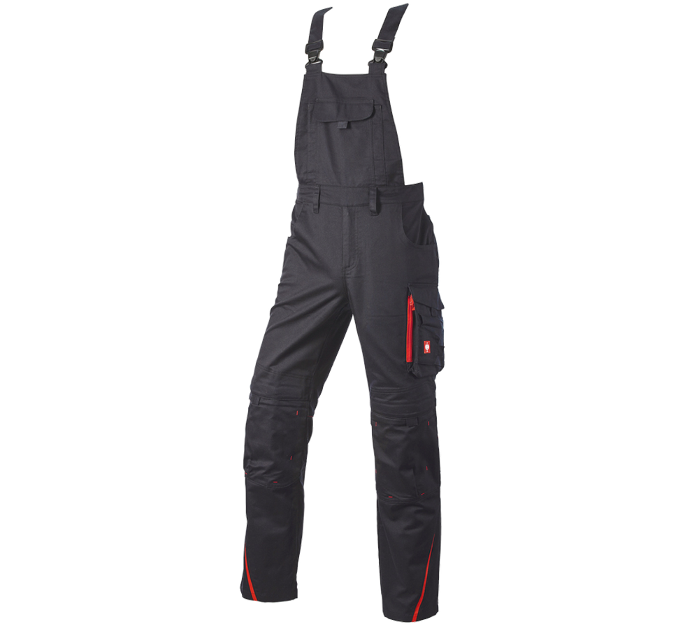 Pracovní kalhoty: Kalhoty s laclem e.s.motion DIY + černá/strauss červená