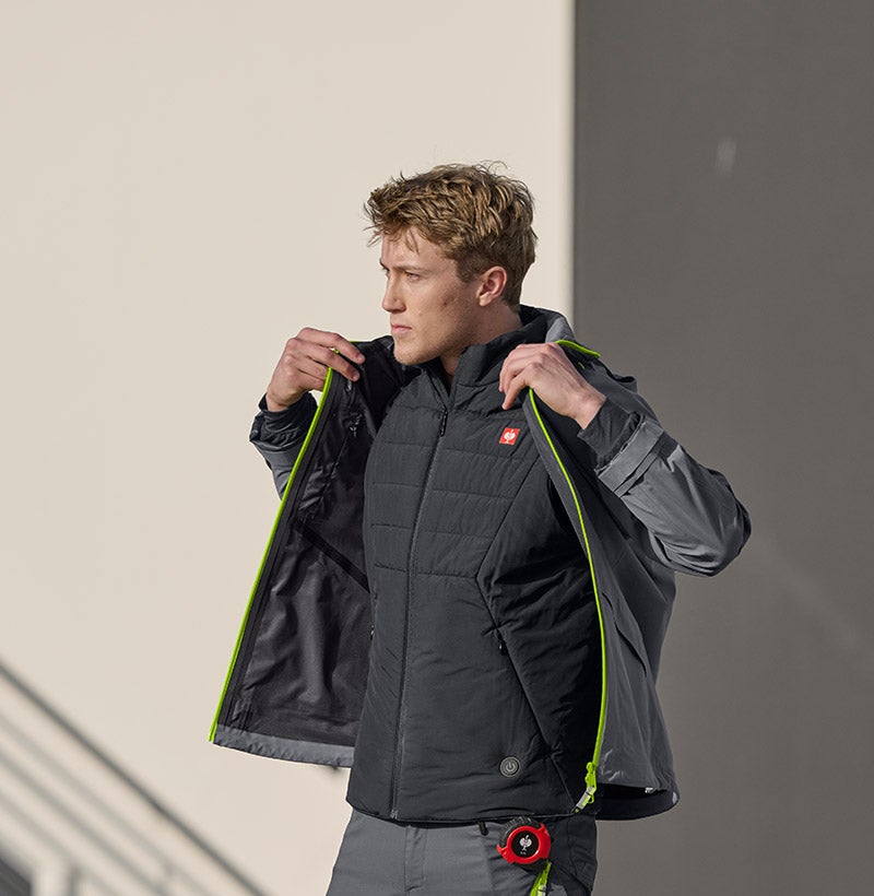 Person wearing a heated vest