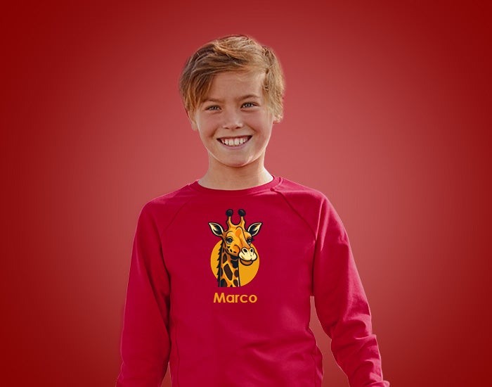 Child wearing a red pullover from Strauss.