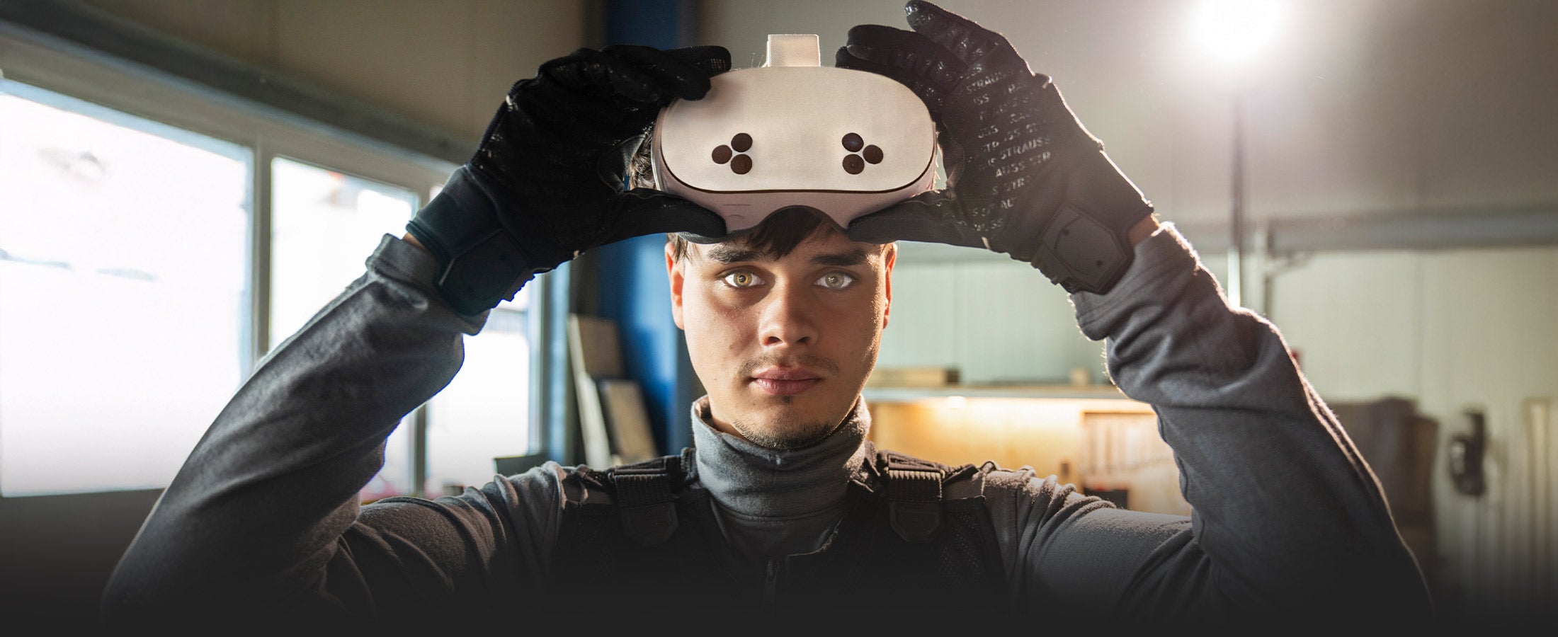 Wearing the Toolbox XR on his wrist, a craftsman measures the angle between two wooden beams.
