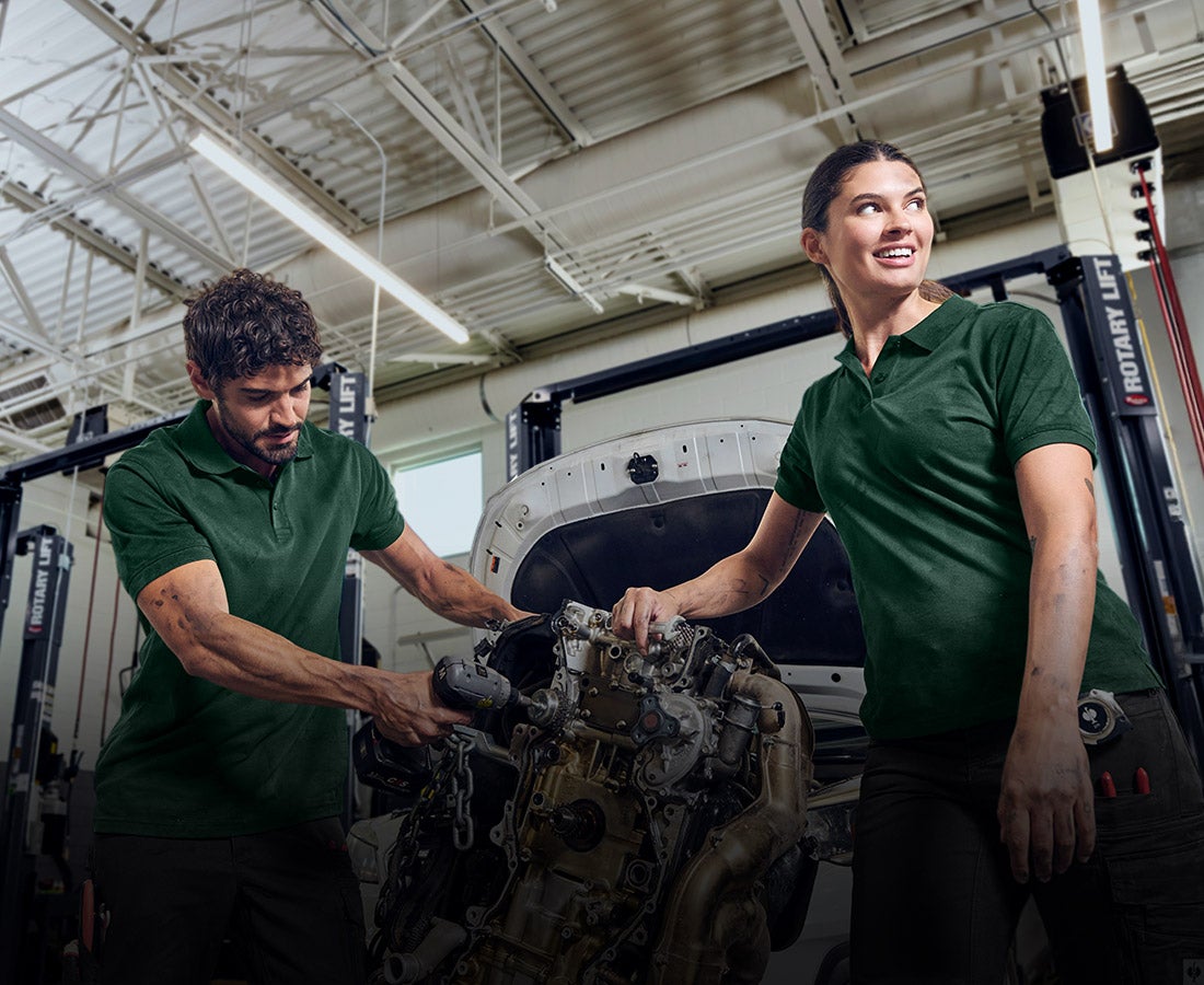 Man and woman wearing green shirts from the e.s.industry collection