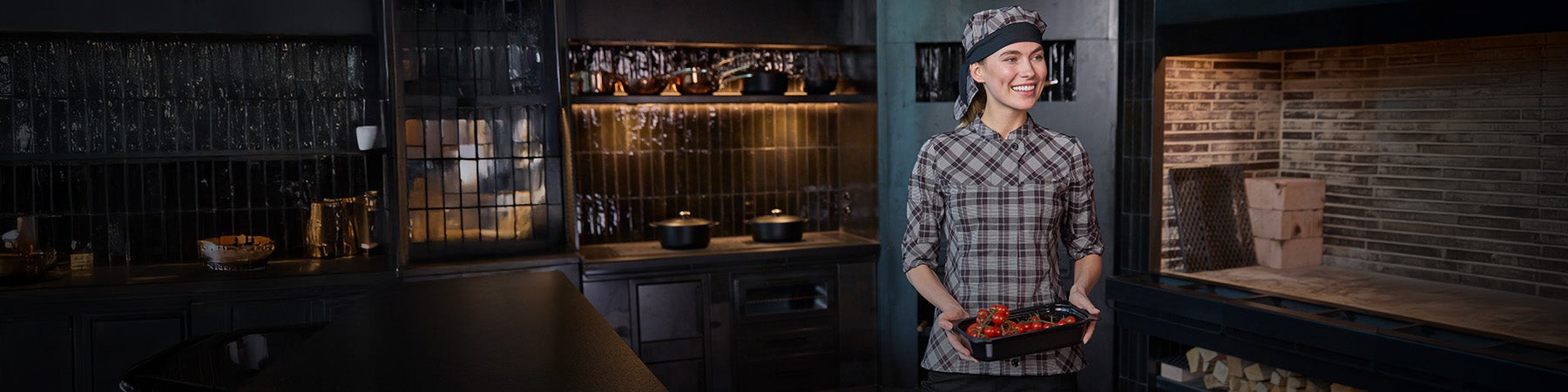 Woman wearing chef's clothing by Strauss