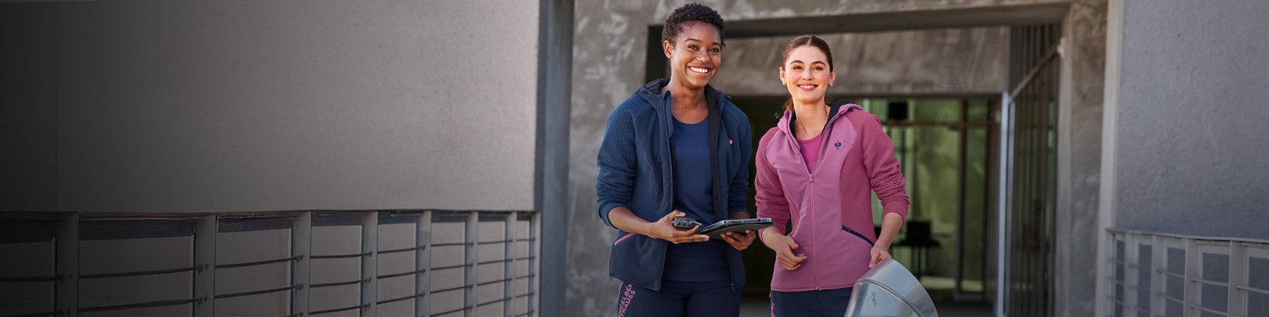 Two women wearing hybrid jackets e.s.trail