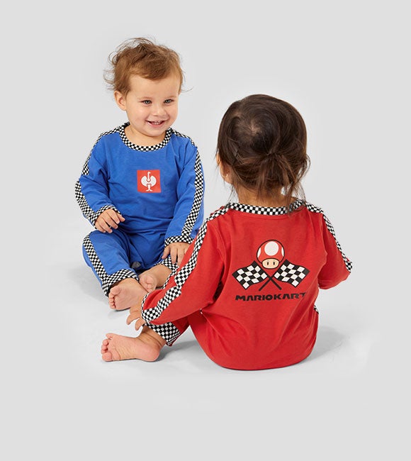 Two babies wearing the new baby overalls