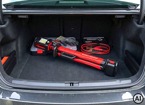 AI-generated / modified – folded work light lying in the trunk