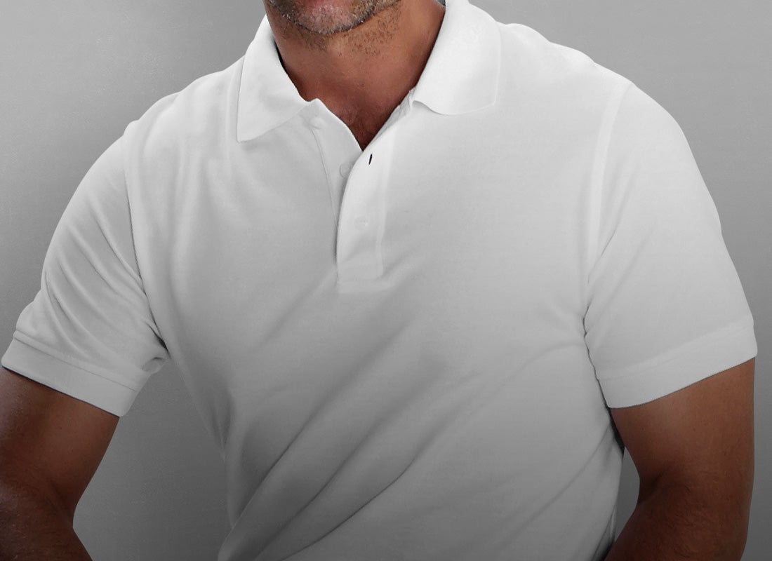 Man wearing a stylish polo shirt in white. 