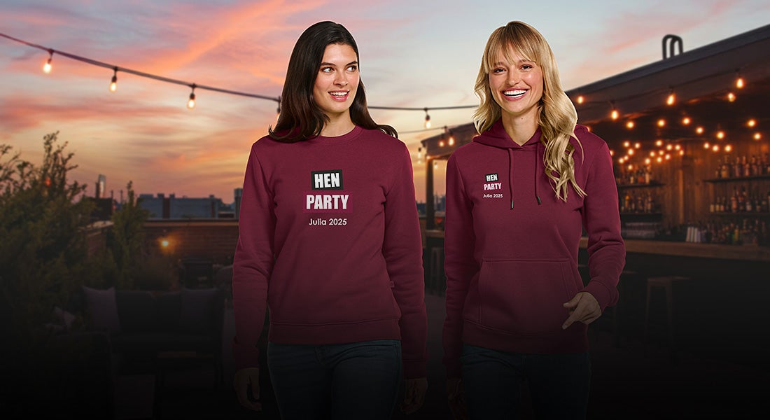 Two ladies in e.s.basics sweatshirts with the print “Bachelorette Party” in the evening