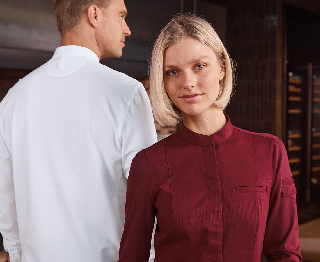 A man and woman wearing the new hospitality shirts.