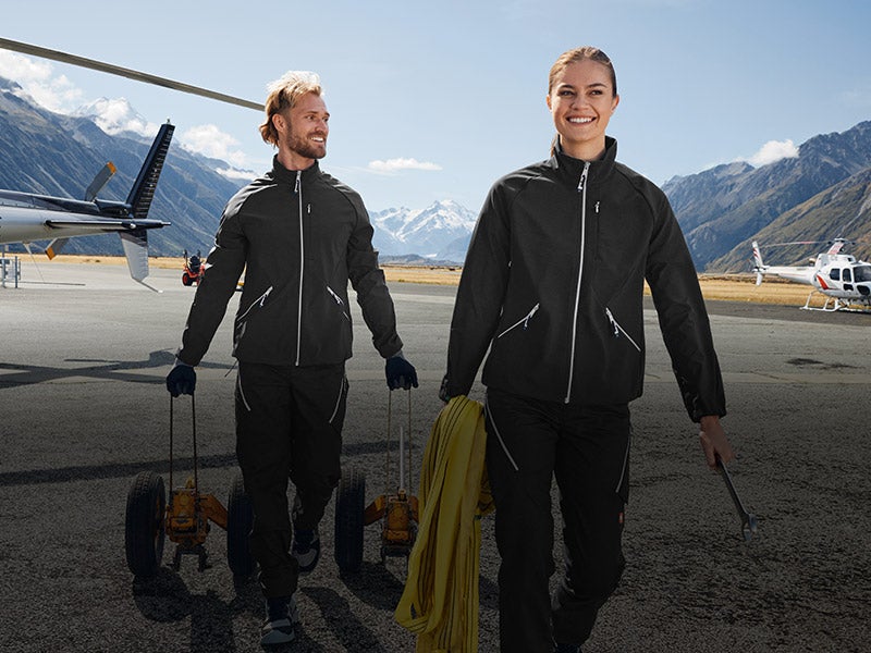 Man and woman wearing the e.s.ambition collection in black/platinum