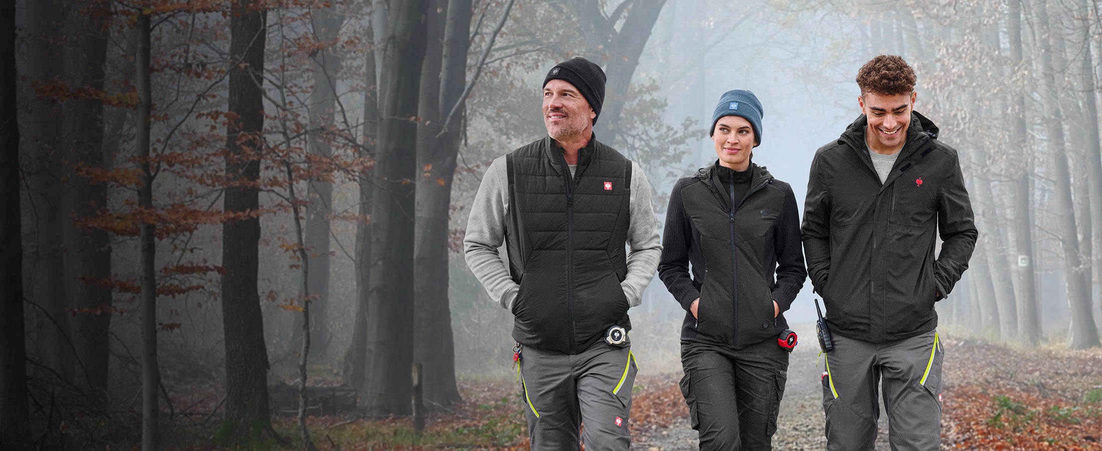Two men and one woman wearing heated products from Strauss